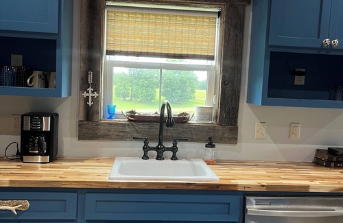 Wheeler House | Barndominium with rustic charm
