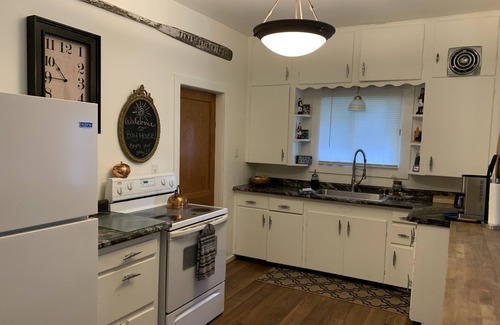 Tawas City House | Bay House Location is perfect for a stroll down Newman Street across from Public Lake Huron Beach!