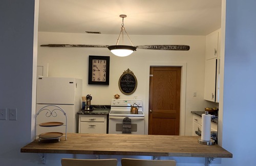 Tawas City House | Bay House Location is perfect for a stroll down Newman Street across from Public Lake Huron Beach!