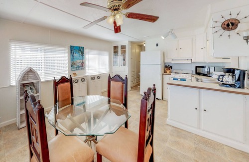 Port Isabel House | Bayfront park model home with deck, pool, hot tub, gym, tennis, & golf