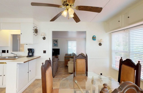 Port Isabel House | Bayfront park model home with deck, pool, hot tub, gym, tennis, & golf
