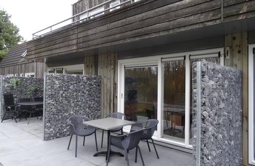 Hollum Apartment | Beach 1 km, on site resort with covered swimming pool, playground, tennis