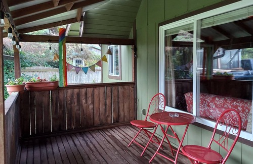 Grayland House | Beach Cabin with covered front porch and back deck with gardens and fire pit
