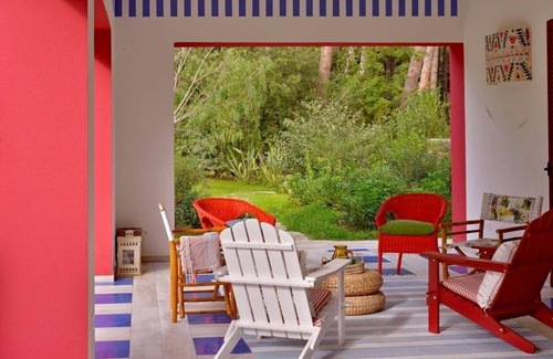 Marina di Bibbona Villa | Beach front Casa Rossa, a modern seaside villa, surrounded by a beautiful garden with lawn and r.
