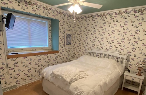 Gwinn Cottage | Beach front lake home, sleeps 8, hot tub, lots of outdoor spaces, docks.