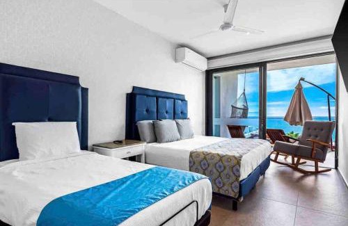 Flamingos Apartment | ~Beach Front~Stunning VIEWS~Free Airport Transport