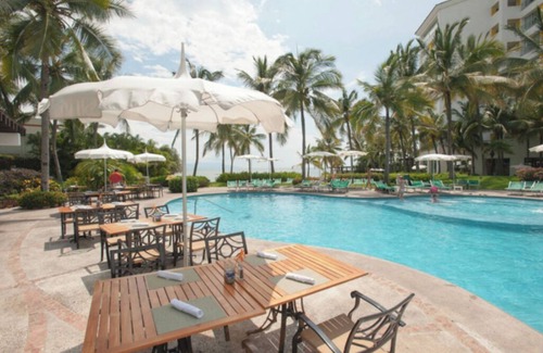 Isla Iguana Apartment | Beach resort w/balcony ft lush pools, dining, fitness, spa & resort activities.