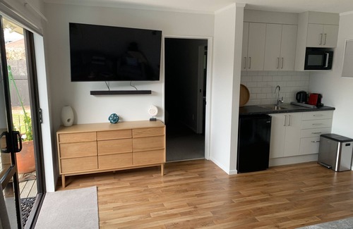 Waikanae House | Beach Road Bach is a newly renovated guesthouse across the street from the beach