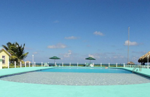San Pedro Cottage | Beach side cottage on Private beach with freshwater pool, "coconut"- RCB