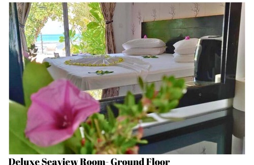 Dhiffushi House | Beach Villa Hotel in Maldives. Just in front of beautiful beach.