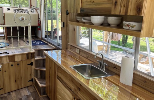 Langsville Boat Rental | Beached houseboat with lots of character and deck jacuzzi