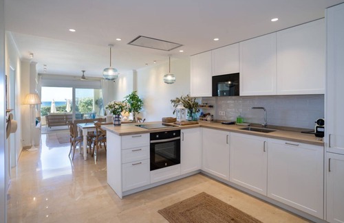 Nikki Beach Apartment | Beachfront complex Neptuno II, sea view, pool and garden, Elviria.