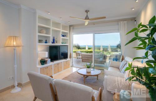 Nikki Beach Apartment | Beachfront complex Neptuno III , sea views, pool and garden,Elviria