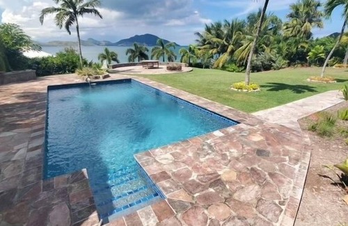 Cliffdwellers Villa | Beachfront Estate with Pool and Tropical Garden