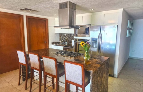 Olimpica Condo | Beachfront Grand Venetian condo