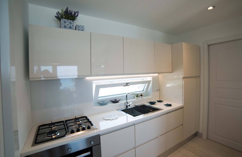Torre San Giovanni Apartment | Beachfront 2nd floor apartment with terrace located east with sunset