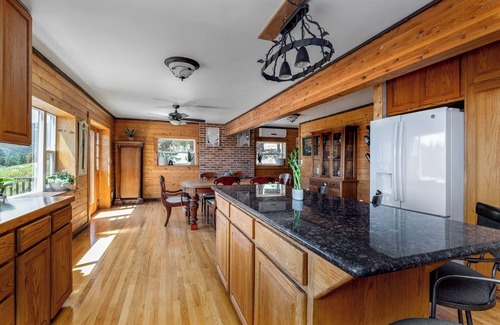 Kettle Falls House | Beautiful 5-bedroom log cabin with spacious rooms and rustic charm.