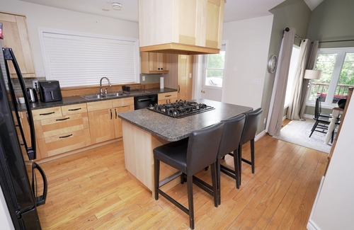 Seguin Cottage | Beautiful 5 bedrooms waterfront cottage sits on a private 4 acres wooded lot!