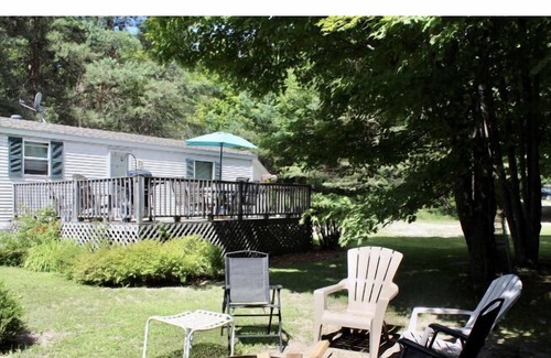 Central Lake House | Beautiful and clean mobile home.Enjoy beautiful Torch Lake, boating, fishing,xx