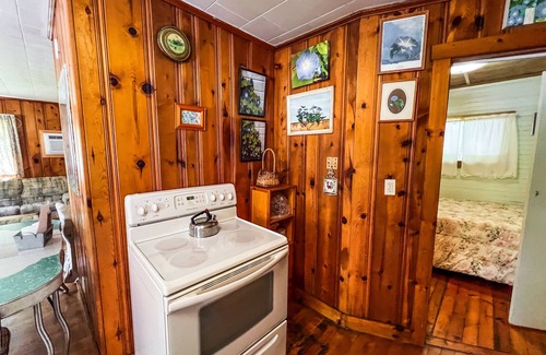 Wells Cottage | Beautiful and serene cottage with beach, dock, lake views, fishing, and A/C