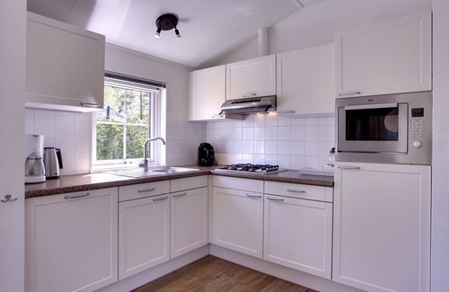 Municipality of Dalfsen House | Beautiful apartment in villa for 4 guests with pool, WIFI, TV, terrace and parking