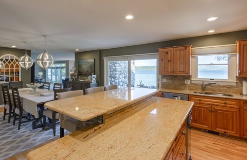Suttons Bay House | Beautiful Beach Front on Suttons Bay with Sunset Views.