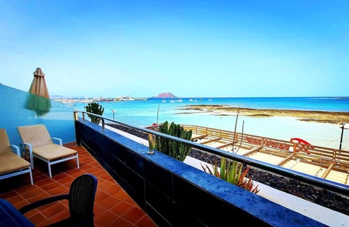 Corralejo Apartment | Beautiful Beachfront APTMTO at waters edge with stunning Ocean and Harbour views