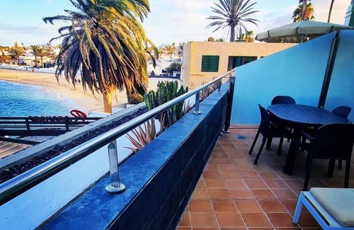 Corralejo Apartment | Beautiful Beachfront APTMTO at waters edge with stunning Ocean and Harbour views