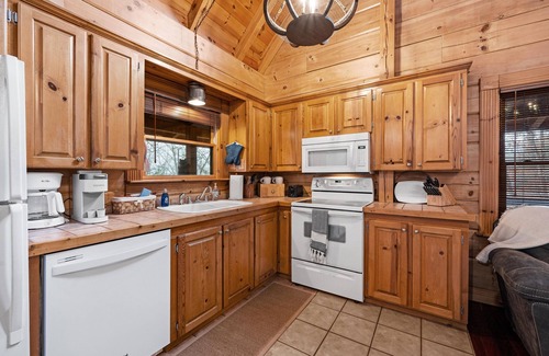 Gatlinburg - Pigeon Forge Cabin | Beautiful cabin nestled among the trees, featuring a loft and relaxing hot tub.