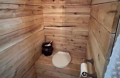 Kent County Cabin | Beautiful cedar treehouse that has wall-to-wall windows, forest and river view!