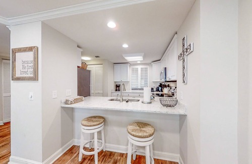 Fernandina Beach Condo | Beautiful condo with pool, balcony overlooking the ocean & fast WiFi - walk to boardwalk
