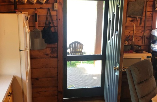 Dedham Cabin | Beautiful cozy Maine log cabin on the water.
