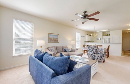 Sunset Beach Condo | Beautiful dog-friendly coastal home close to beach, AC, and shared pool.