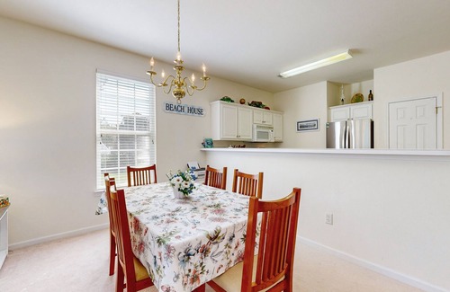 Sunset Beach Condo | Beautiful dog-friendly coastal home close to beach, AC, and shared pool.