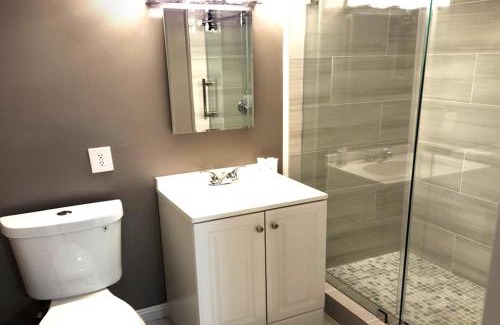 Bluff Heights Apartment | Beautiful Guesthouse, Sleeps 4 - Kitchen, Private Laundry, AC, Parking, 65' TV, Close to Stores, Restaurants & Beach