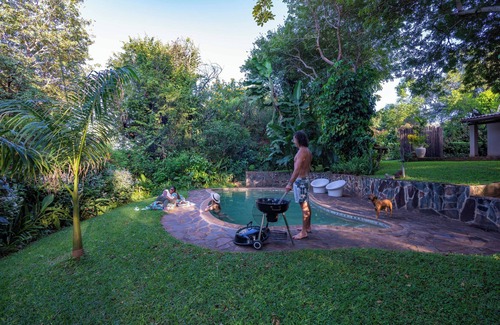 Victoria Falls House | Beautiful home, lush garden, and pool. Walking distance to town and waterfall.