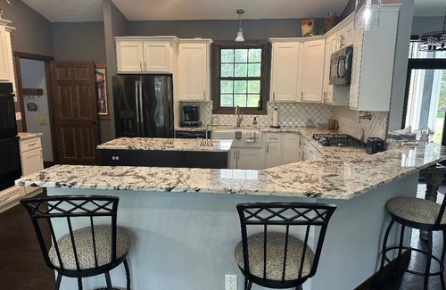 Grand Rapids House | BEAUTIFUL lake front home with a private beach, dock and large yard