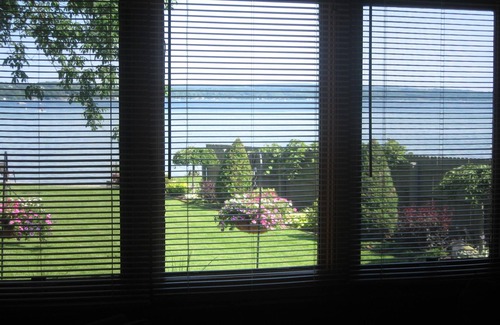 Auburn Apartment | Beautiful log sided, on Owasco Lake w/private beach, entrance and parking.