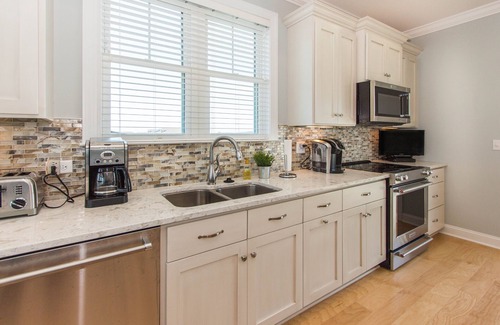 Ocean Isle Beach House | Beautiful new Custom Oceanfront home with XL covered decks, pool and elevator.