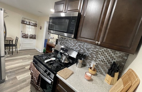 Sharon Hill House | Beautiful newly renovated home near airport with fireplace & sunroom.