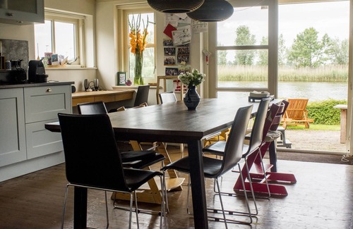 Municipality of Weesp House | Beautiful original windmill along the riverside