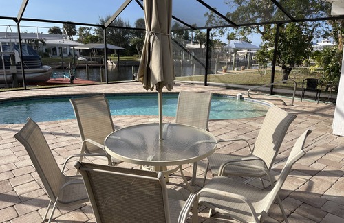 Bokeelia Apartment | Beautiful pool home on canal with 45-foot boat dock. 10 minutes to Gulf by boat.