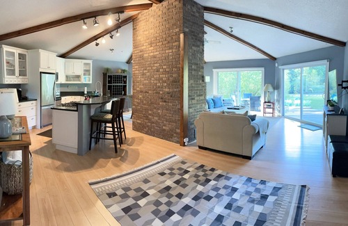 Mayfield House | Beautiful private home on the Boardman River with large yard, deck and hot tub.