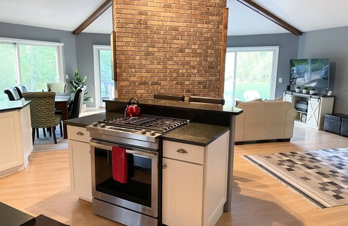Mayfield House | Beautiful private home on the Boardman River with large yard, deck and hot tub.