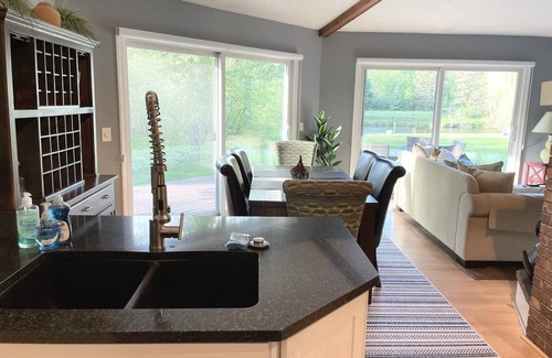 Mayfield House | Beautiful private home on the Boardman River with large yard, deck and hot tub.