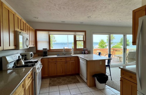 Traverse City House | Beautiful spot on Lake Leelanau- 4 bedrooms-includes dock and kayaks.