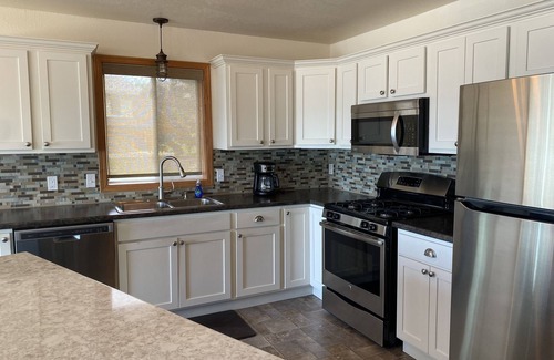 Spirit Lake House | Beautiful sunsets on sand beach of Big Spirit Lake front home!