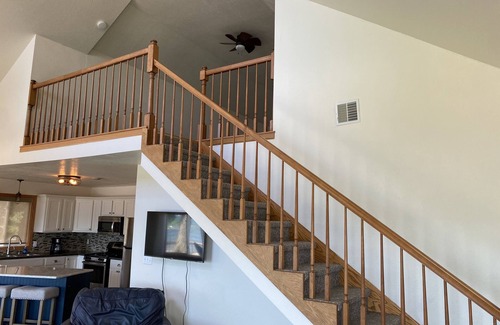 Spirit Lake House | Beautiful sunsets on sand beach of Big Spirit Lake front home!
