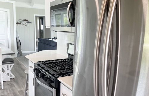 Onekama House | Beautiful updated home with 100’ on Portage Lake - 20 minutes to Arcadia Bluffs