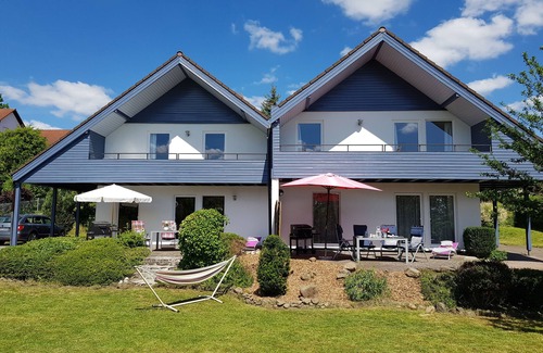 Roth House | Beautiful vacation home with south-facing terrace, modern furniture and new box-spring bed.